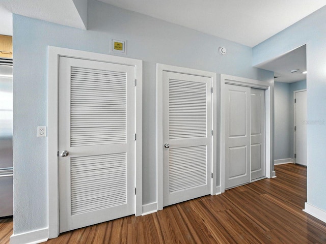 1208 E Kennedy Blvd Unit 1125, Tampa, FL 33602 - unfurnished bedroom featuring multiple closets and wood finished floors