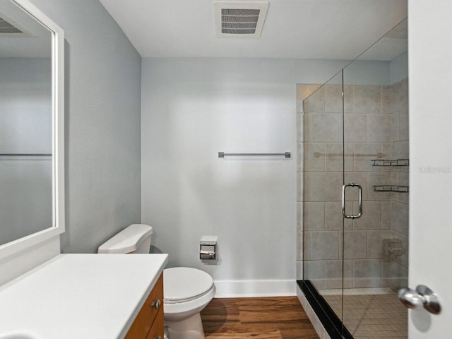 1208 E Kennedy Blvd Unit 1125, Tampa, FL 33602 - bathroom with vanity, a stall shower, and wood finished floors