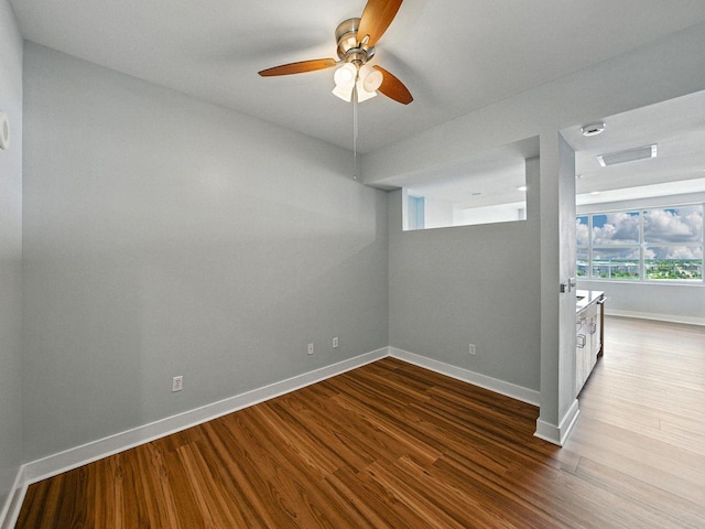 1208 E Kennedy Blvd Unit 1125, Tampa, FL 33602 - spare room with dark wood-style flooring and a ceiling fan