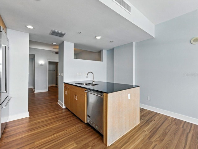 1208 E Kennedy Blvd Unit 1125, Tampa, FL 33602 - kitchen featuring stainless steel dishwasher, wood finished floors, recessed lighting, a peninsula, and dark countertops