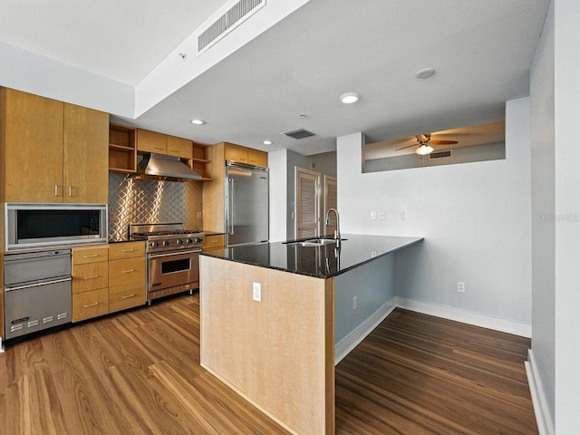 1208 E Kennedy Blvd Unit 1125, Tampa, FL 33602 - kitchen featuring premium appliances, under cabinet range hood, open shelves, dark wood finished floors, and recessed lighting