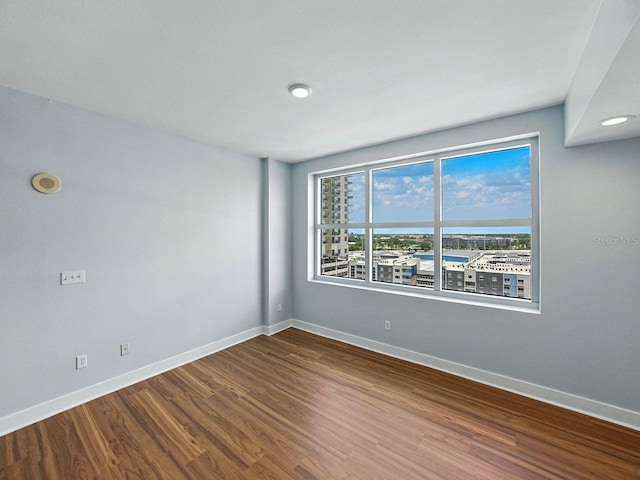 1208 E Kennedy Blvd Unit 1125, Tampa, FL 33602 - spare room featuring wood finished floors and baseboards