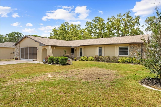 ranch-style home with an attached garage, driveway, stucco siding, and a front yard