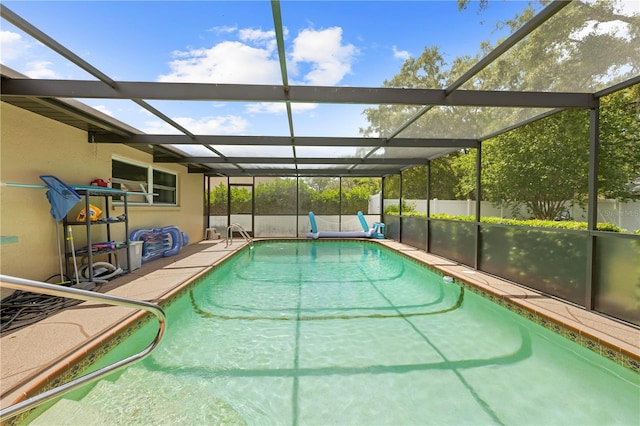 view of pool with a fenced in pool, a lanai, and a patio area