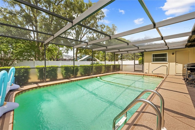 view of pool featuring fence, grilling area, a patio, a fenced in pool, and glass enclosure