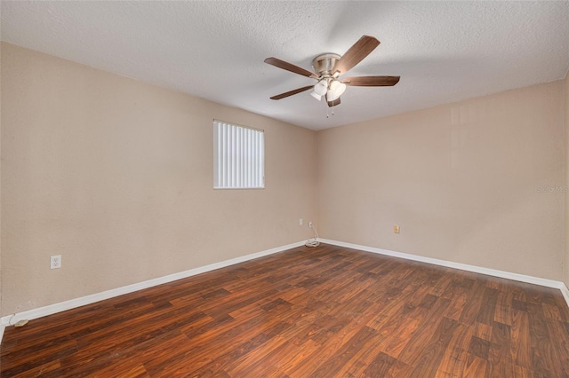 unfurnished room with baseboards, a textured ceiling, ceiling fan, and dark wood-style floors