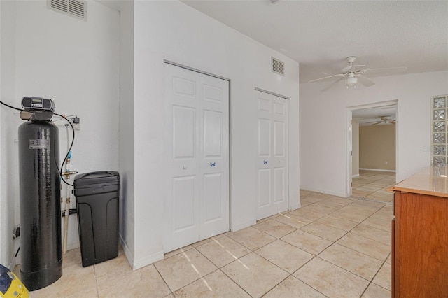 interior space featuring visible vents and light tile patterned flooring