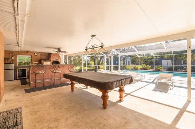 game room with a swimming pool, billiards, a ceiling fan, and beverage cooler