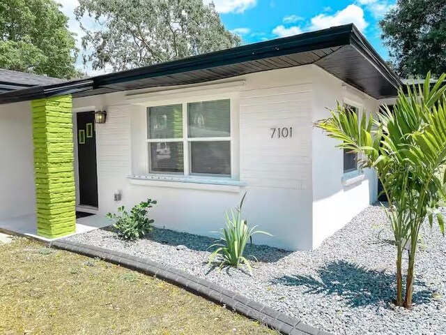 7101 N 9th St, Tampa, FL 33604 - view of side of property with stucco siding
