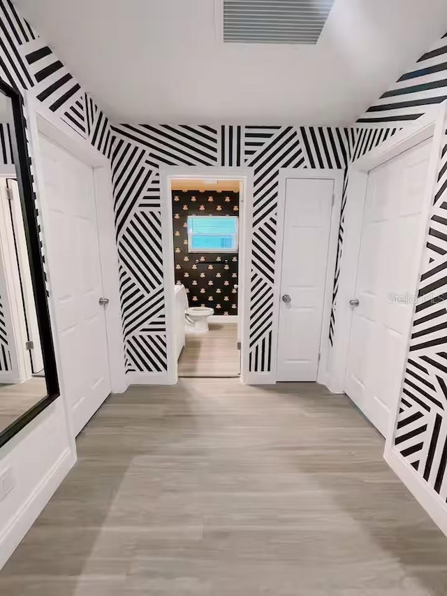 7101 N 9th St, Tampa, FL 33604 - hall featuring wallpapered walls and wood finished floors