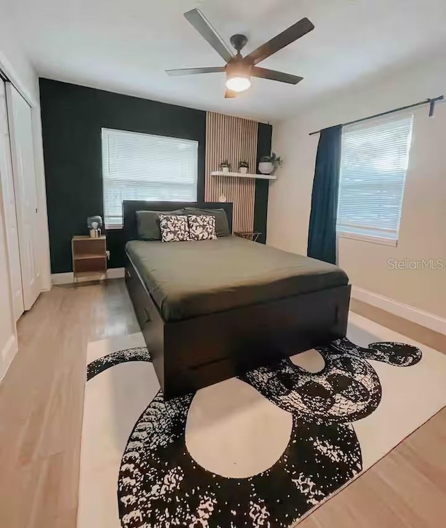 7101 N 9th St, Tampa, FL 33604 - bedroom featuring ceiling fan, wood finished floors, and baseboards