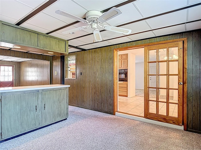13116 N Oregon Ave, Tampa, FL 33612 - spare room with a ceiling fan, wooden walls, and a healthy amount of sunlight