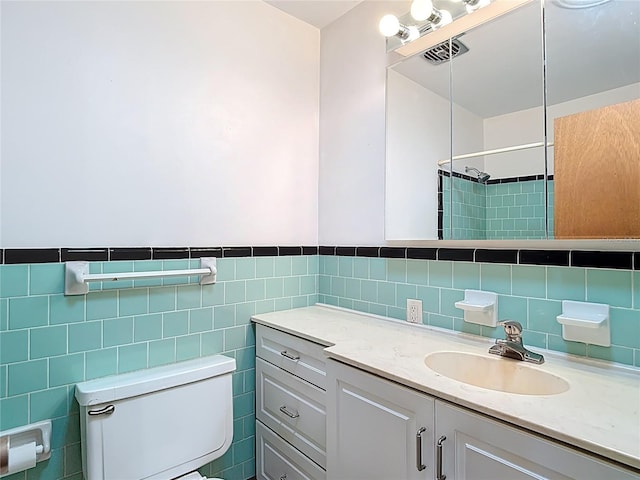 13116 N Oregon Ave, Tampa, FL 33612 - full bath with toilet, tile walls, visible vents, a shower, and vanity