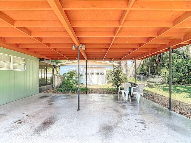 13116 N Oregon Ave, Tampa, FL 33612 - view of patio featuring an outbuilding and fence