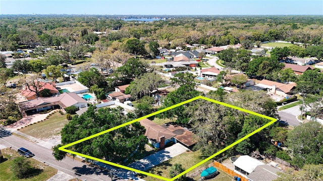13116 N Oregon Ave, Tampa, FL 33612 - aerial view of residential area with property boundaries highlighted and a heavily wooded area