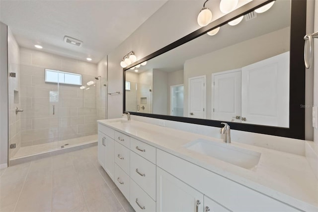 5001 21st Ave N, Saint Petersburg, FL 33710 - full bath with a stall shower, tile patterned flooring, double vanity, and recessed lighting