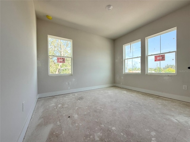5001 21st Ave N, Saint Petersburg, FL 33710 - spare room featuring plenty of natural light and a smoke detector