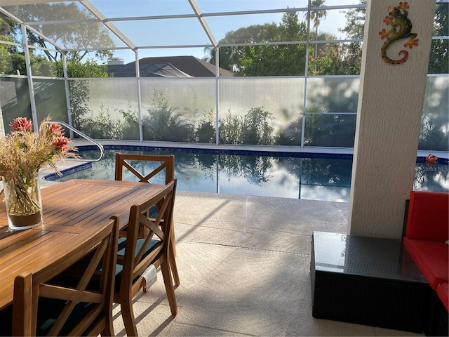 outdoor pool with a lanai and a patio