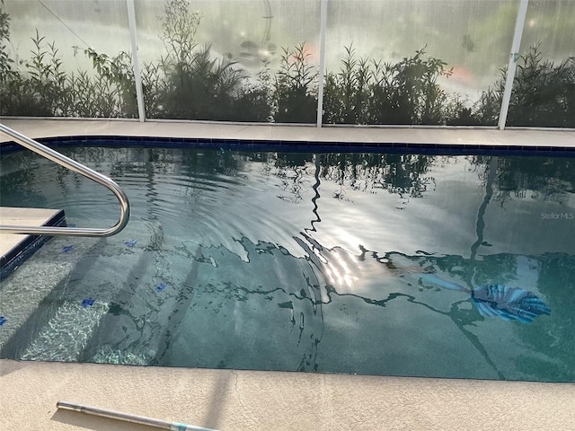 swimming pool with glass enclosure