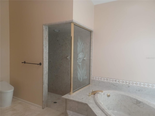 bathroom featuring tile patterned floors, a garden tub, a walk in shower, and toilet