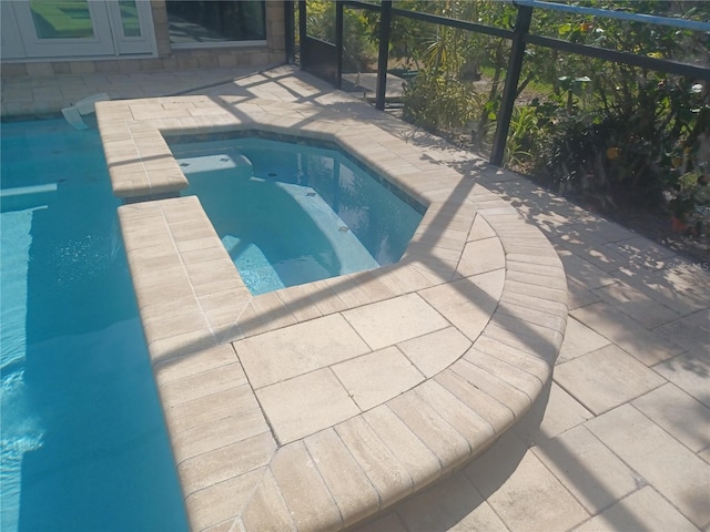 pool with a patio area
