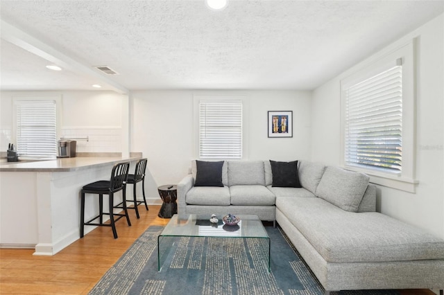 3611 4th Ave N, Saint Petersburg, FL 33713 - living area with visible vents, recessed lighting, wood finished floors, and a textured ceiling