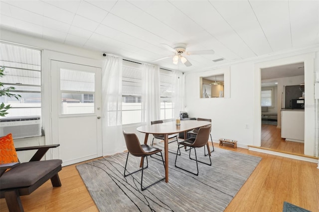 3611 4th Ave N, Saint Petersburg, FL 33713 - dining area with ceiling fan, cooling unit, and wood finished floors