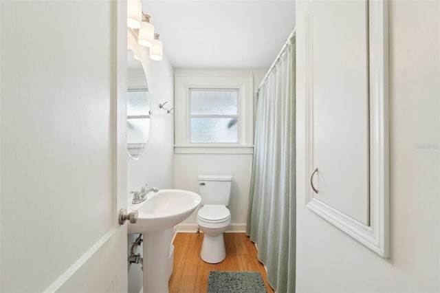 3611 4th Ave N, Saint Petersburg, FL 33713 - bathroom featuring toilet, wood finished floors, and a sink