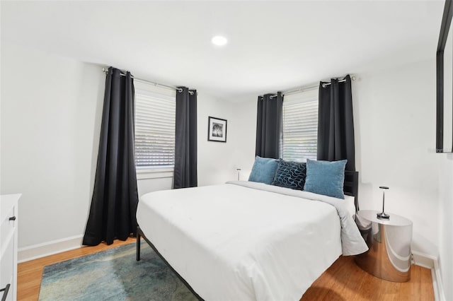 3611 4th Ave N, Saint Petersburg, FL 33713 - bedroom featuring multiple windows, baseboards, and wood finished floors