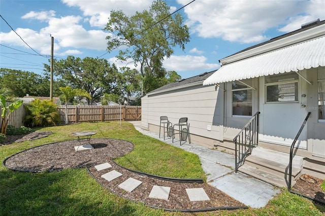 3611 4th Ave N, Saint Petersburg, FL 33713 - view of yard featuring a patio area, entry steps, and a fenced backyard