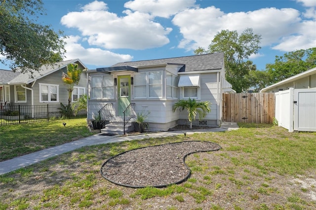 3611 4th Ave N, Saint Petersburg, FL 33713 - bungalow-style home with a front yard, a fenced backyard, entry steps, and a gate