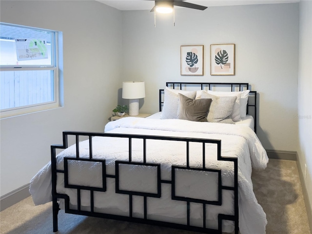 carpeted bedroom featuring baseboards