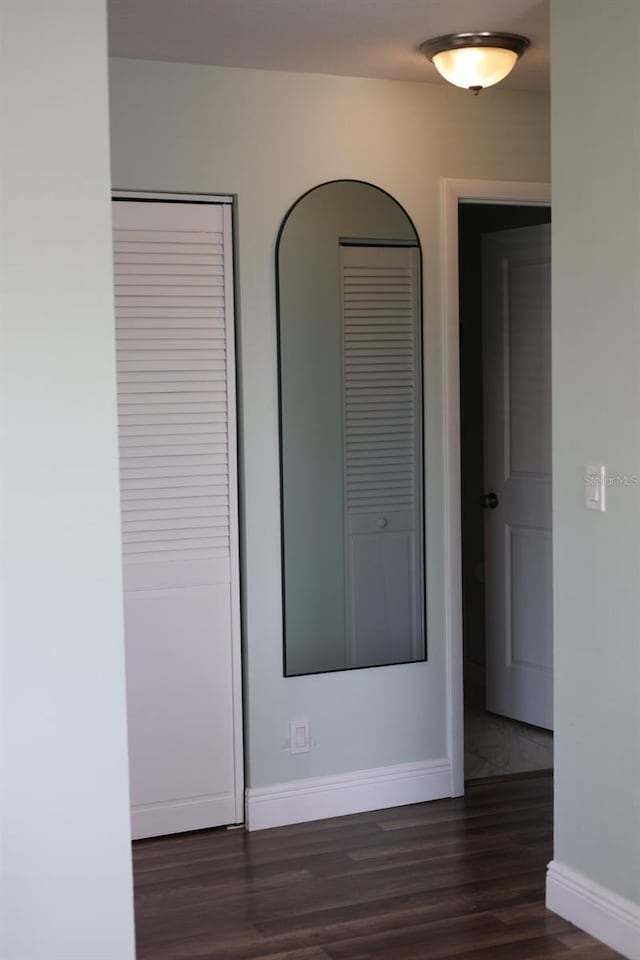 5973 Terrace Park Dr N Unit 311, Saint Petersburg, FL 33709 - unfurnished room with dark wood-style flooring and baseboards
