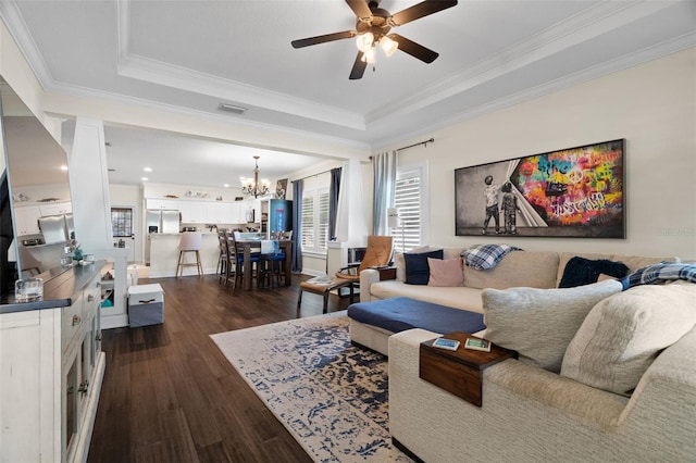 1410 25th St N, Saint Petersburg, FL 33713 - living area featuring a raised ceiling, dark wood-type flooring, visible vents, and ceiling fan with notable chandelier