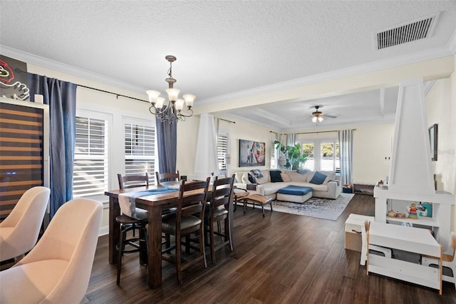 1410 25th St N, Saint Petersburg, FL 33713 - dining area featuring visible vents, a textured ceiling, ornamental molding, and dark wood-style flooring