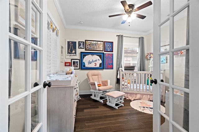 1410 25th St N, Saint Petersburg, FL 33713 - bedroom featuring crown molding, a crib, french doors, baseboards, and dark wood-style floors