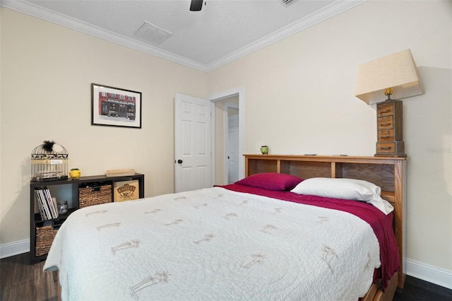 1410 25th St N, Saint Petersburg, FL 33713 - bedroom with dark wood-type flooring, crown molding, and baseboards