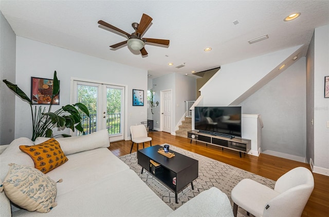 805 100th Ave N, Saint Petersburg, FL 33702 - living room featuring ceiling fan, wood finished floors, stairs, and visible vents