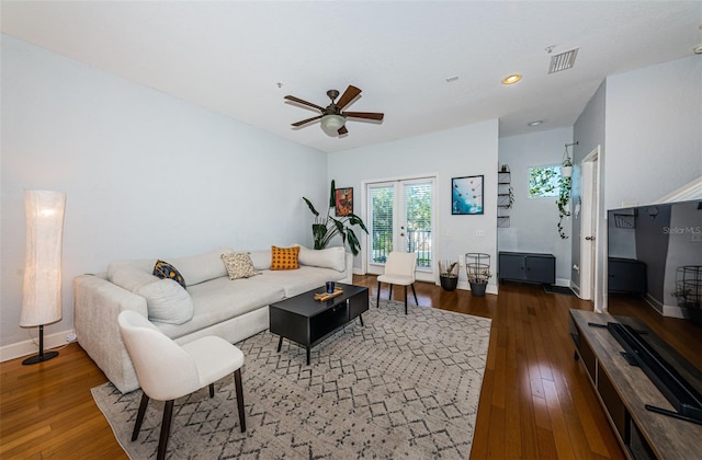 805 100th Ave N, Saint Petersburg, FL 33702 - living area featuring hardwood / wood-style flooring, baseboards, and a ceiling fan