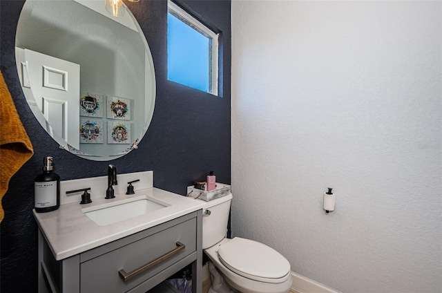 805 100th Ave N, Saint Petersburg, FL 33702 - bathroom with a textured wall, vanity, and toilet
