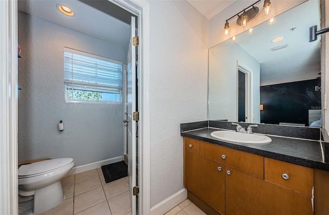 805 100th Ave N, Saint Petersburg, FL 33702 - bathroom with vanity, visible vents, toilet, tile patterned floors, and baseboards