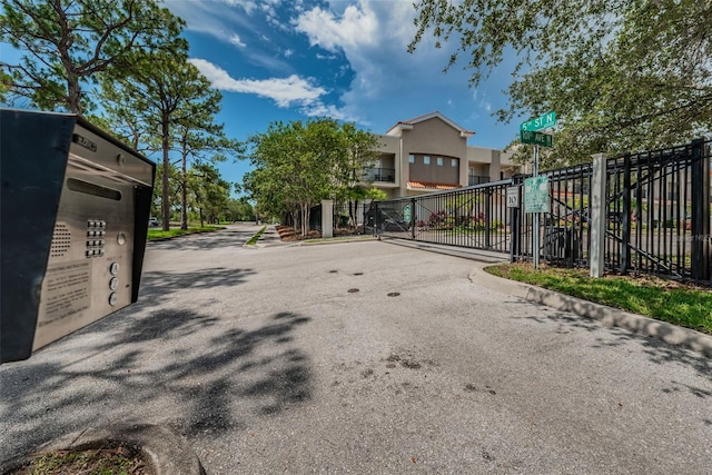 805 100th Ave N, Saint Petersburg, FL 33702 - view of road featuring a gate, a gated entry, and curbs