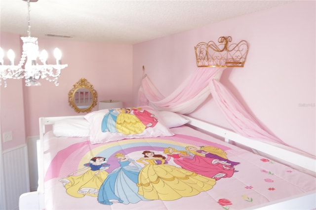 151 Pompano Beach Dr, Kissimmee, FL 34746 - bedroom with a chandelier and a textured ceiling