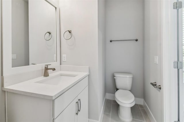 445 31st Way N, Saint Petersburg, FL 33713 - bathroom featuring baseboards, tile patterned flooring, vanity, and toilet