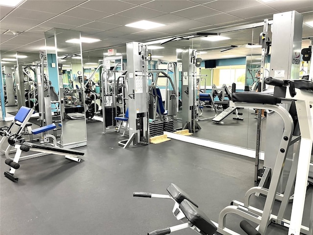 exercise room with a drop ceiling