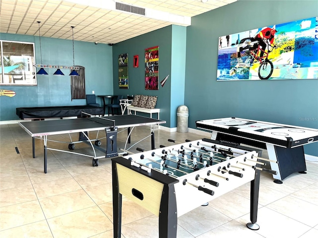 playroom featuring tile patterned floors, visible vents, and baseboards
