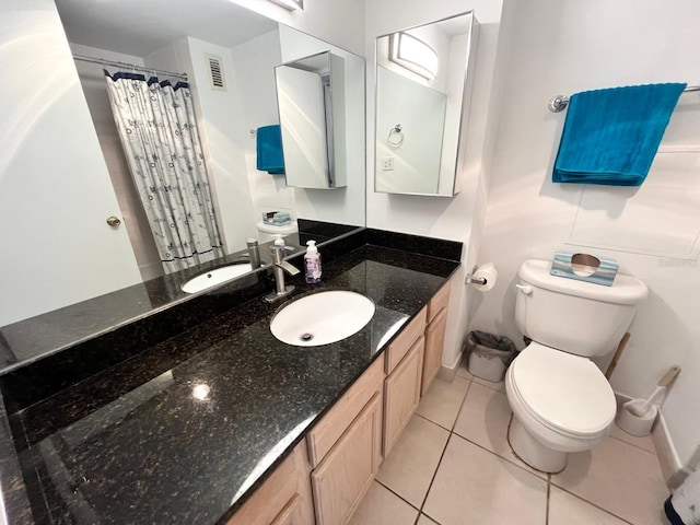 full bathroom with visible vents, curtained shower, toilet, vanity, and tile patterned flooring