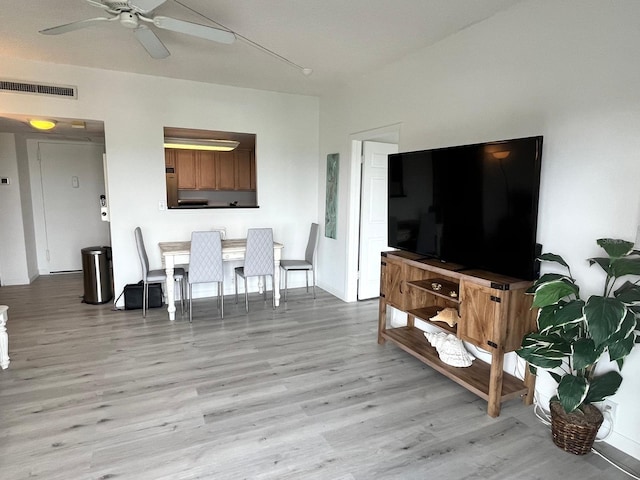 dining room with visible vents, a ceiling fan, and light wood-style floors