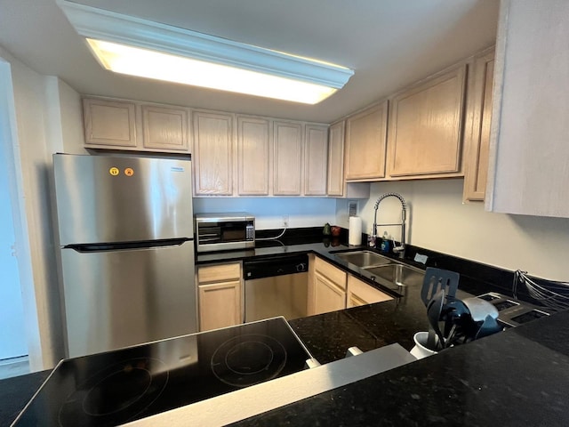 kitchen with a sink and appliances with stainless steel finishes
