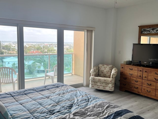 bedroom featuring access to outside and light wood-style floors